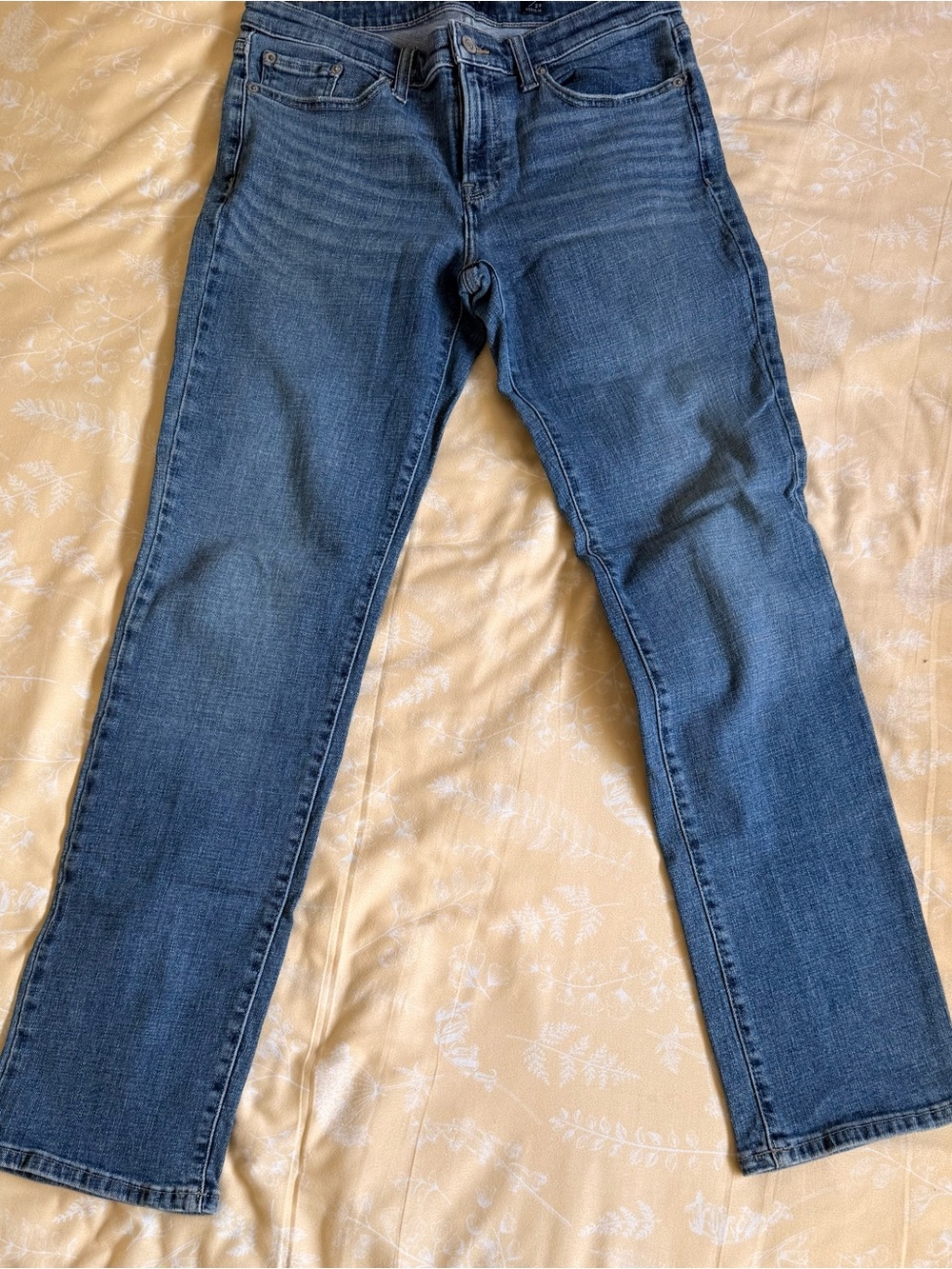 Lucky Brand light blue denim jeans with tan leather patch